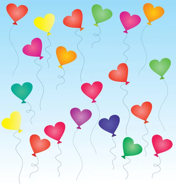 Barevné balónky ve tvaru srdce na modré obloze — Stock fotografie