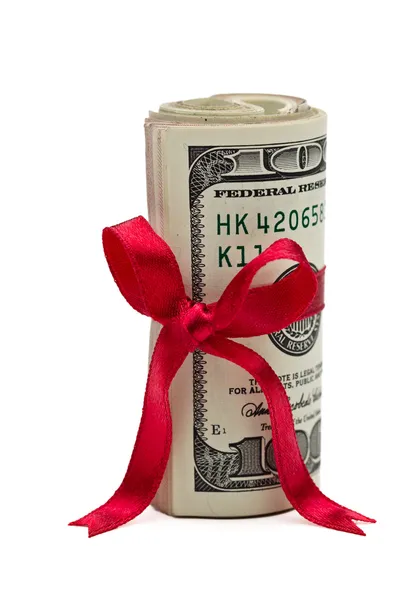 Wad de dinero en efectivo con arco rojo —  Fotos de Stock