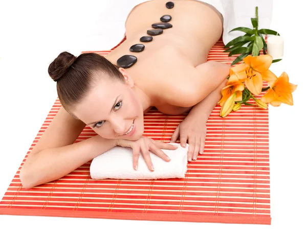 Žena s masážní kameny Stock Snímky
