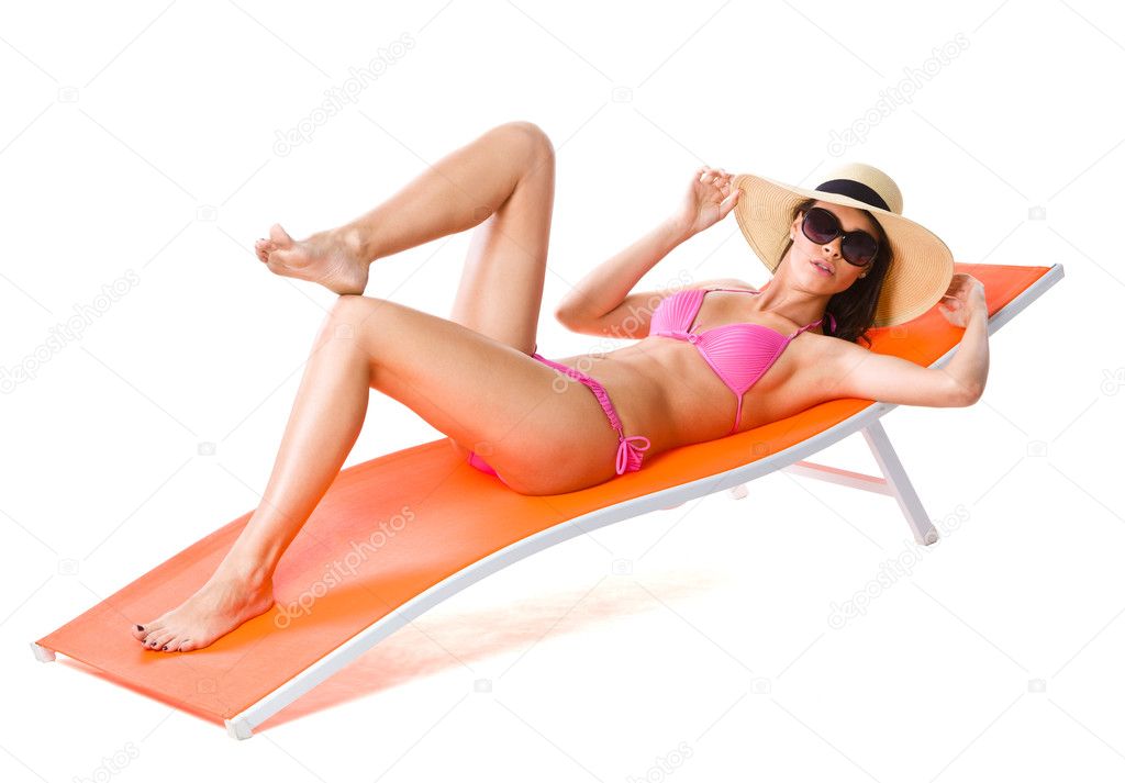 Cute woman on orange sunbed