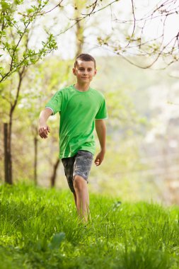 Boy walking outdoor clipart