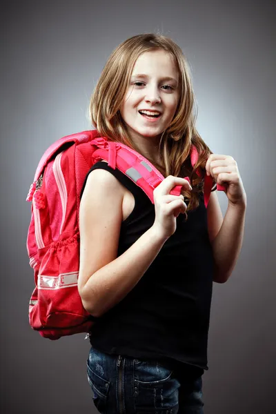 Estudante loira com mochila em estúdio — Fotografia de Stock