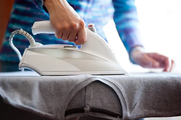 Woman's hands ironing — Stock Photo, Image