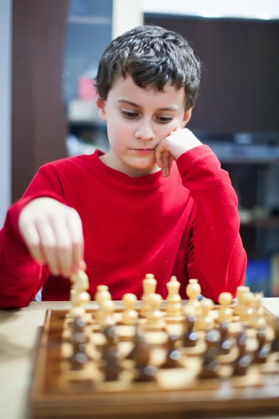 Boy playing chess, selective focus — Stock Photo, Image