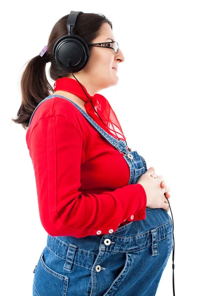 Mulher grávida com fones de ouvido — Fotografia de Stock