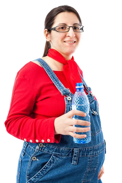 Schwangere mit Wasserflasche Stockbild