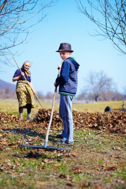 Family at work in an orchard clipart