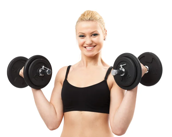 Athletic young lady working out with weights Royalty Free Stock Images
