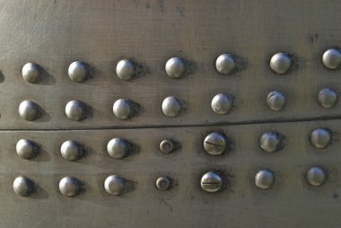 Metal texture with rivets and screw clipart