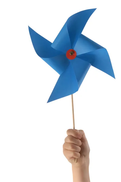 Main d'enfant avec moulin à vent bleu — Photo