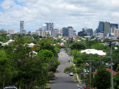 Brisbane city in queensland australia shown from suburban street clipart
