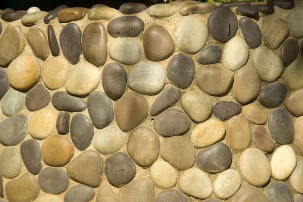 Vägg av runda stenar — Stockfoto