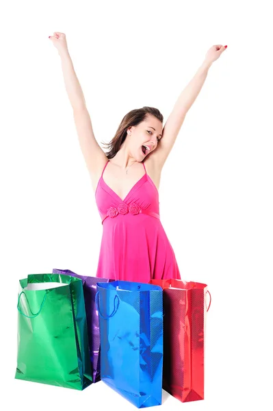 Lycklig flicka med shoppingväskor — Stockfoto