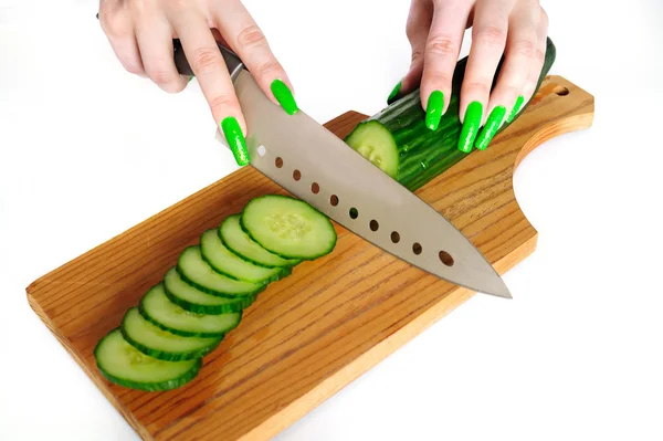 Cutting cucumbers — Stock Photo, Image