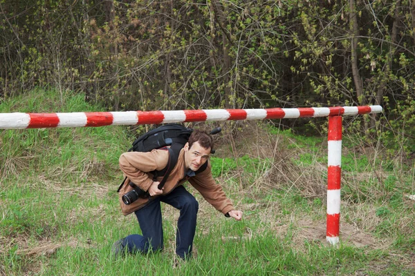 stock image A young man passes under the barrier