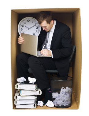 Businessman in a tight office clipart