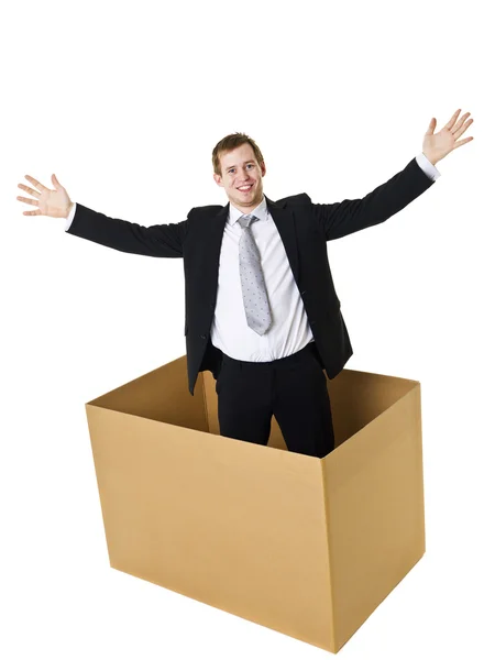 Бізнесмен у картонній коробці — стокове фото