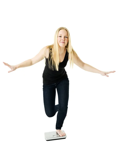 Girl on weight scale — Stock Photo, Image