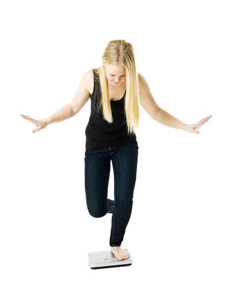 Girl on weight scale — Stock Photo, Image