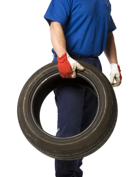 Man with tire — Stock Photo, Image