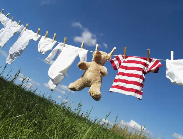 Baby clothing on a clothesline — Stock Photo, Image