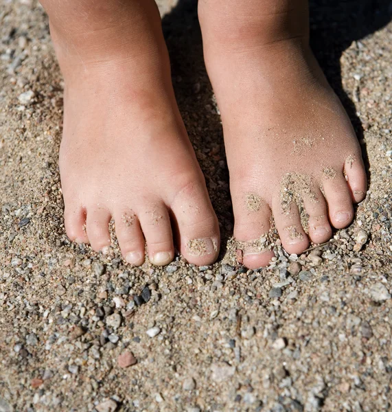 Feet in sand — Stock Photo, Image