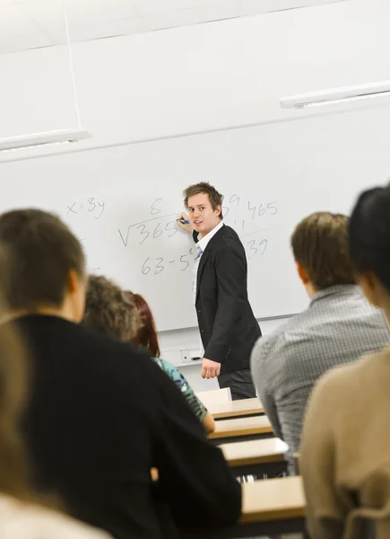 Teacher in classroom — Stock Photo, Image