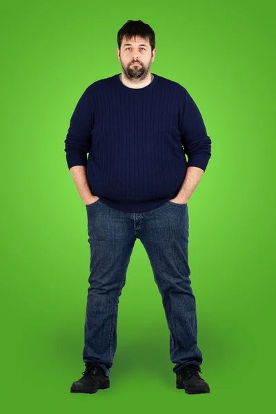 緑色の画面の前に完全に大きな男 — ストック写真