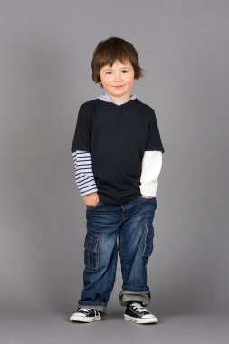 Boy with hands in pockets clipart