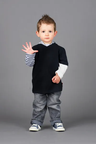 Little boy waving Stock Picture