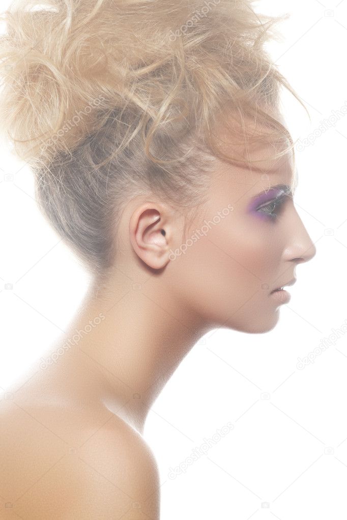 Wellness, spa portrait. Sensual profile of young woman model with big curly bun hairstyle, beautiful neck on white backgound. Natural white light mist