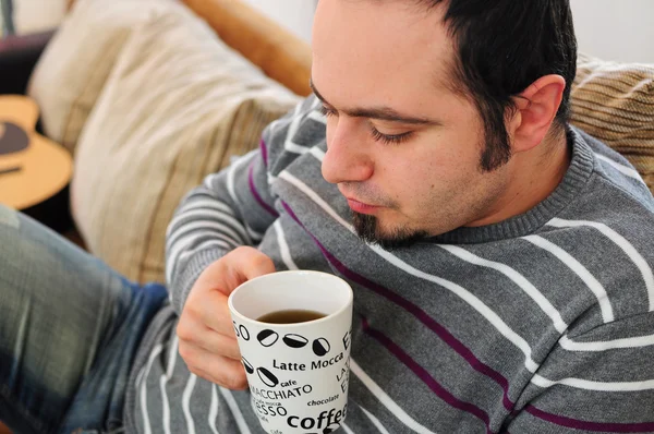 Young man with coffee or tea — Stock Photo, Image
