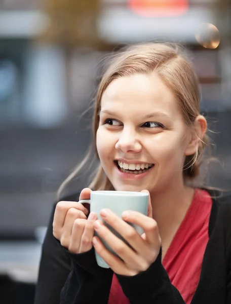 Pretty young woman with cup of chocomilk — Stock Photo, Image