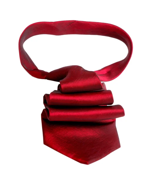 Corbata de satén roja aislada en blanco apuntando a la derecha — Foto de Stock