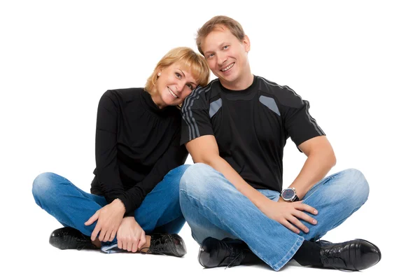 Belo casal apaixonado sentado na posição de lótus — Fotografia de Stock