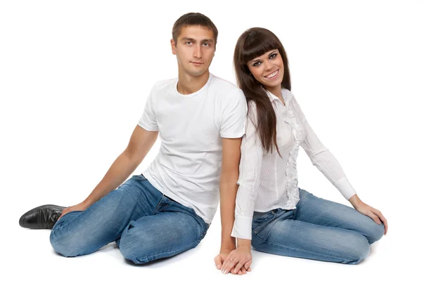 Romantic young couple sitting on floor — Stock Photo, Image