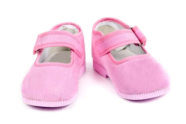 Een paar van roze babyslofjes — Stockfoto