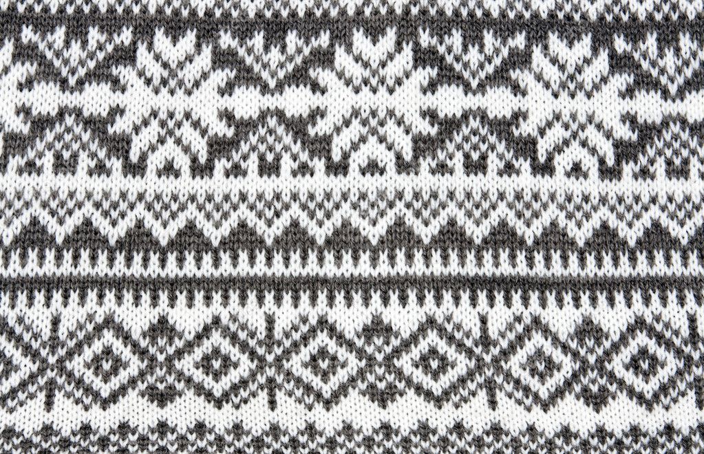 Gray background with a knitted pattern