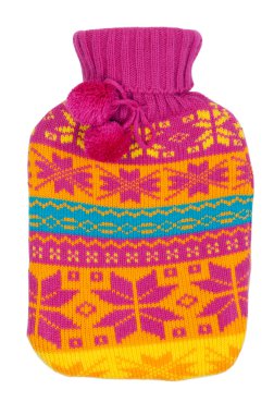 Rubber hot water bottle in a knitted cover color clipart