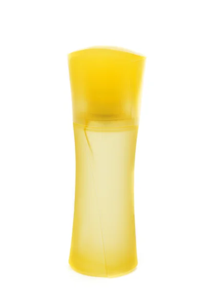 Желтая бутылка духов — стоковое фото