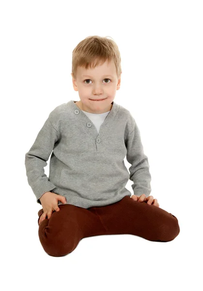 Dziecko siedzi — Zdjęcie stockowe