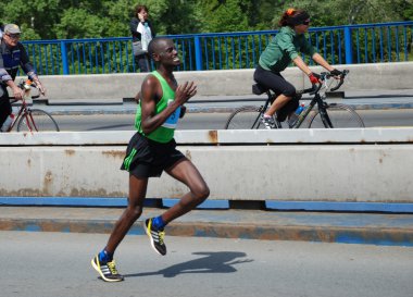 BELGRADE, SERBIA - APRIL 22: James Kiptum Barmasai runs on April 22, 2012 in Belgrade marathon clipart