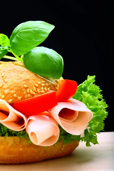 stock image Delicious roll full of ham, paprika and lettuce