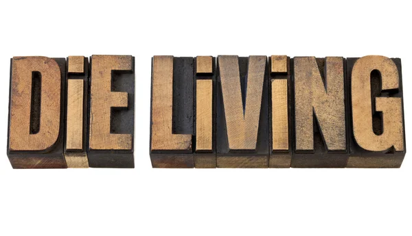 Die living advice in wood type — Stock Photo, Image