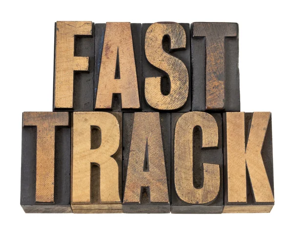 Fast track words in wood type — Stock Photo, Image