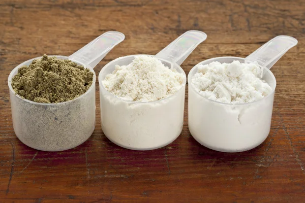 Scoops of protein powder — Stock Photo, Image