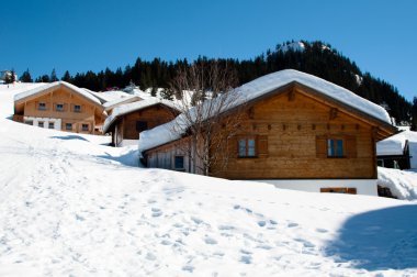 Skiing huts in Montafon clipart