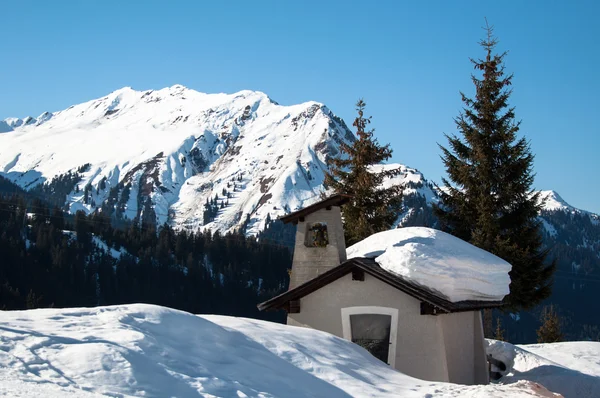 Small chapel in skiing resort Royalty Free Stock Images