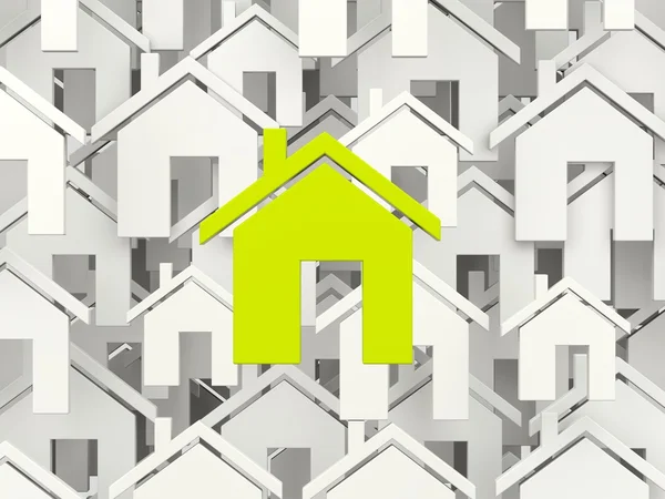 Símbolo de casa verde sobre casas cinzentas — Fotografia de Stock