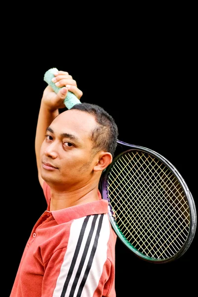 Handsome ethnic young man with tennis racket on hand — Stock Photo, Image
